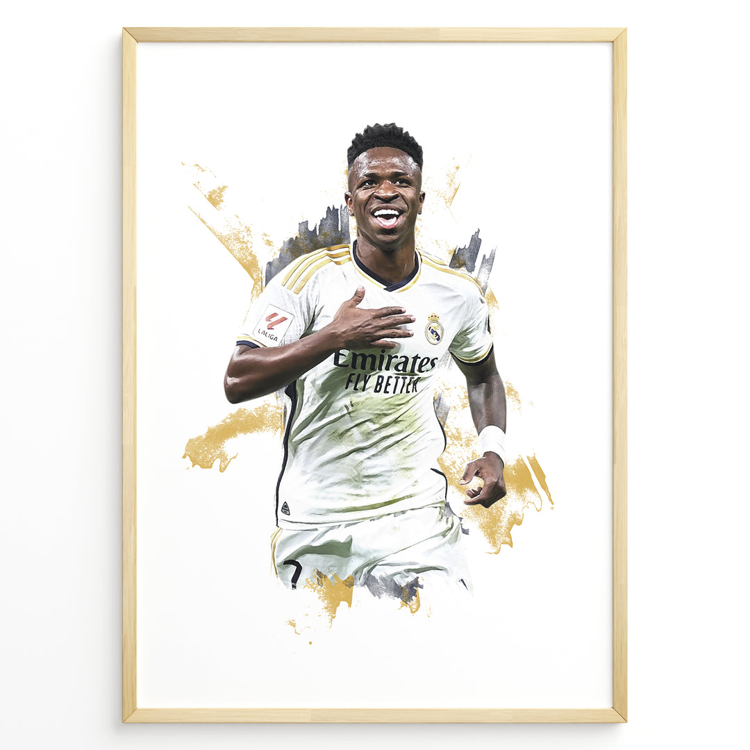 Framed watercolor-style plakat of Vinícius Jr. celebrating in a Real Madrid jersey with a gold artistic background