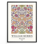 Load image into Gallery viewer, Framed William Morris Hyacinth 1887 floral art print plakat with colorful symmetrical flower and leaf design on a light background.
