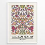 Load image into Gallery viewer, Framed William Morris Hyacinth 1887 floral art print plakat with colorful symmetrical flower and leaf design on a light background.

