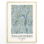 Load image into Gallery viewer, William Morris Sweet Briar 1887 botanical floral pattern art print with blue and beige leaves and flowers in black frame plakat.
