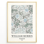 Load image into Gallery viewer, Framed William Morris Seaweed 1866 art print plakat featuring intricate seaweed-inspired floral and leaf motifs in blue and green on a cream background.
