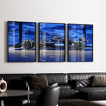 Load image into Gallery viewer, Triptych wall art plakat of the Williams Racing FW46 Formula 1 car with a bold blue background, displayed in a contemporary living room with black leather furniture.
