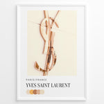 Load image into Gallery viewer, Fashion Plakat | Yves Saint Laurent Paris – Rose Gold Emblem Poster Plakaty.dk | Rose gold Yves Saint Laurent logo on a soft beige background with a neutral color palette and Paris/France label beneath.
