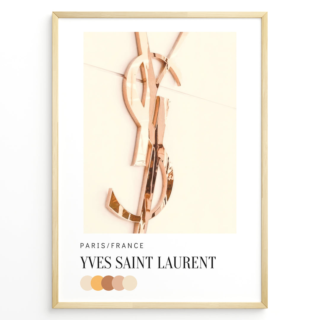 Fashion Plakat | Yves Saint Laurent Paris – Rose Gold Emblem Poster Plakaty.dk | Rose gold Yves Saint Laurent logo on a soft beige background with a neutral color palette and Paris/France label beneath.