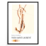 Load image into Gallery viewer, Fashion Plakat | Yves Saint Laurent Paris – Rose Gold Emblem Poster Plakaty.dk | Rose gold Yves Saint Laurent logo on a soft beige background with a neutral color palette and Paris/France label beneath.
