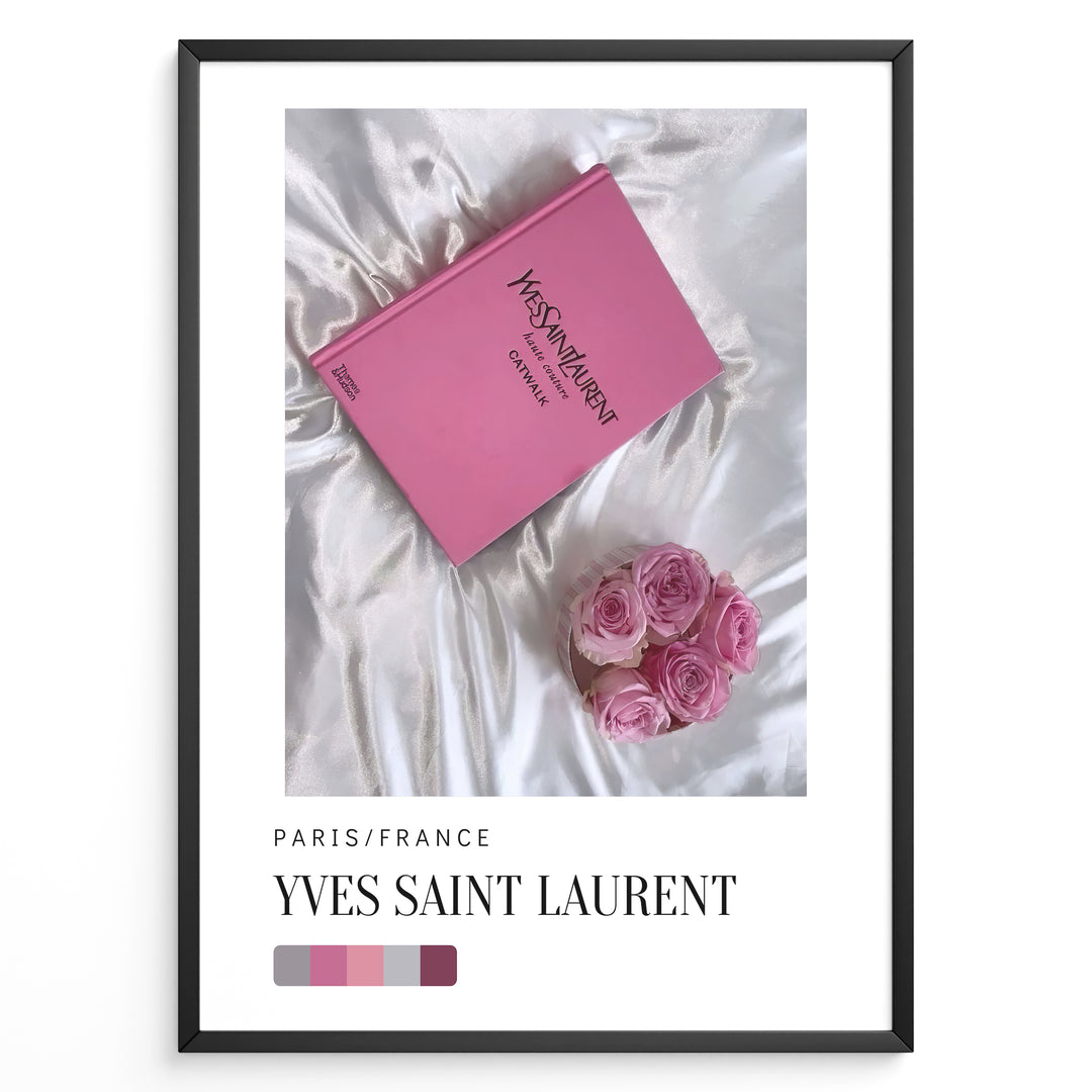 Fashion Plakat | Yves Saint Laurent Pink Book on Silk – Paris Fashion Decor Plakaty.dk | Yves Saint Laurent pink Catwalk book placed on white silk fabric with pink roses beside it, representing Parisian luxury and soft elegance.