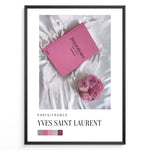 Load image into Gallery viewer, Fashion Plakat | Yves Saint Laurent Pink Book on Silk – Paris Fashion Decor Plakaty.dk | Yves Saint Laurent pink Catwalk book placed on white silk fabric with pink roses beside it, representing Parisian luxury and soft elegance.
