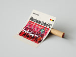 Load image into Gallery viewer, Manchester United FC holdfoto plakat | Spillerne i røde hjemmebanetrøjer 2024-2025 med holdskjold foran og fokuserede udtryk.
