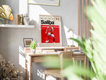Load image into Gallery viewer, William Saliba fodbold plakat | Arsenal FC-spiller i rød-hvid hjemmebanetrøje, stilfuldt og moderne plakatdesign.
